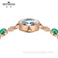 SKYSEED emerald type mother-of-pearl watch